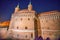 Krakows Barbican at night. Medieval defensive building fortress. Central entrance doors of famous landmark in old town of Krakow,