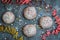 Krapfen, Berliner or donuts with streamers, confetti and mini marshmallows on blue background. Colorful carnival or birthday image