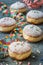 Krapfen, Berliner or donuts with streamers, confetti and mini marshmallows on gray background