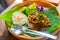 `Krapow Moo Kai Dow` or pork basil and chili stir fry with fried egg