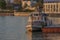 Krasnodar, Russia, May 5, 2019. Kuban river in the evening in Krasnodar, Pier and river tram on the water. View of the waterfront