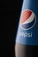 Krasnoyarsk, Russia February 23, 2020: Pepsi-fragment of the brand label on the bottle close-up on a black background