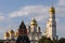 Kremlin architectural ensemble at sunny day. Golden domes of churches sparkle in the sun.