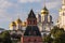 Kremlin architectural ensemble at sunny day. Golden domes of churches sparkle in the sun.