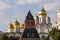 Kremlin architectural ensemble at sunny day. Golden domes of churches sparkle in the sun.