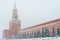 Kremlin chiming clock of the Spasskaya Tower in Moscow, Russia at wintertime during snowfall