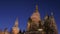 Kremlin tower and Saint Basil Cathedral against dark night sky, picturesque static shot