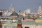 Kremlin tower with a star. Roofs of the Kremlin buildings. Temple domes, modern buildings.