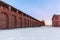 Kremlin wall and tower in the historic centre of red brick snowy winter with a horizontal arrangement