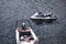 Kreta or Crete  Greece : A white jet ski and a motor boat floating or docked on a clean water