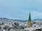 Kristiansand, Norway - January 17, 2018: Winter in Kristiansand City. Snow covered church tower in the city, emerging