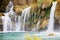 Krka, Sibenik, Croatia - Watrefall spume spraying into a cascade at Krka National Park