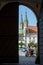 Kromeriz, Czech Republic. View of the street through the courtyard arches and gates.