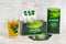 KROPIVNICKY, UKRAINE - JUNE 11, 2019: Box of Green Greenfield tea with cup of tea on light background