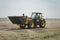 Kropivnitskiy, Ukraine April 20, 2019: The JCB bucket loader, Tractor at a demonstration site agro exhibition AgroExpo. Tractor