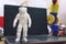 Kropivnitskiy, Ukraine â€“ 12 may, 2018: 3D printed astronaut, cosmonaut, robot on the background of devices and laptop. Spaceman