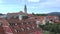 Krumlov. Architecture of a medieval city with a church tower. Panorama of the Czech city Cesky Krumlov. Historical
