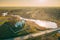 Krupets, Dobrush District, Gomel Region, Belarus. Aerial View Of Old Wooden Orthodox Church Of The Holy Trinity At Sunny