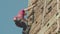 Kryvyi Rih, Ukraine - 05.23.2021 a rock climber climbs a stone stand, a column of an old bridge, an old climbers hockey