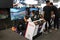 KUALA LKUALA LUMPUR, MALAYSIA -NOVEMBER 23, 2017: People playing with race car simulation game. Displayed with big-screen monitors