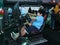 KUALA LKUALA LUMPUR, MALAYSIA -NOVEMBER 23, 2017: People playing with race car simulation game. Displayed with big-screen monitors