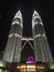 Kuala Lumpur, Malaysia - April 22, 2017: Night view of illuminated Petronas Twin Towers and the bridge in Kuala Lumpur, Malaysia