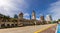 Kuala Lumpur, Malaysia - June 12, 2022: Old and new icon of the malaysian capital. The clock tower of Sultan Abdul Samad Building