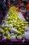 Kuala Lumpur, Malaysia - October 16, 2020: A vegetable stand with Lohan Guava or Jambu Batu fruits on the counter, in the street