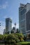 Kuala Lumpur Tower in betwen buildings and coconut trees