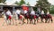 Kuban Cossacks on horses performing tricks on the on open-air