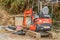 Kubota backhoe parked in driveway