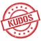 KUDOS text written on red vintage stamp