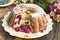 Kugelhopf with Berries on a Rustic Wooden Table