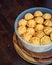 Kuih Bahulu, baulu or bolu in a container. Sponge cake baked in special aluminium moulds is the Asian tradition food in popular