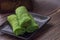 Kuih Dadar or Kuih Tayap Malaysian Pandan Crepes with Sweet Coconut Filling-Traditional food photography