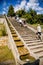 Kuks, East Bohemia, Czech Republic, 10 July 2021: well or a fountain with statues of Triton Greek god of sea, staircase with water