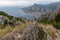 Kula - Scenic aerial view of coastal town Omis surrounded by Dinara mountains in Split-Dalmatia, South Croatia. Hiking trail