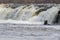 Kuldiga, Latvia - April 1, 2017: The diver is looking for hidden illegal fishing nets in the Venta River and under the waterfall.