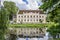 Kuldiga, Latvia - July 3, 2023: Kuldiga District Court with reflection in pond