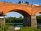 Kuldiga, Latvia - Juny 4, 2022: An extreme sportsman jumps on a rope from the bridge. Ropejumping, bungee jumping