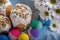 Kulich, traditional Russian Ukrainian Easter cake with colored eggs and flowers