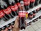 KULIM,MALAYSIA - CIRCA OCTOBER,2019 : A hand holding a bottle of Coca Cola Light at supermarket