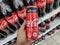 KULIM,MALAYSIA - CIRCA OCTOBER,2019 : A hand holding a can of Coca Cola No Sugar at supermarket