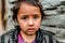 Kullu, Himachal Pradesh, India - April 01, 2019 : Portrait himachali girl near her house on the street in Himalayan village