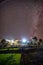 Kullu, Himachal Pradesh, India - November 30, 2018 : Boy under milkyway over indian village in Autumn season in mountains