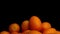 Kumquat on a black background close-up view