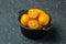 kumquat fruits on a dark background. Healthy and detox food concept