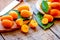 Kumquat on plate at wooden table