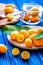 Kumquat on plate at wooden table