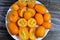 Kumquats, cumquats, a group of small, angiosperm, fruit-bearing trees in the family Rutaceae, golden orange, an edible fruit